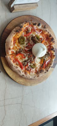 Pizza with burrata in the middle 